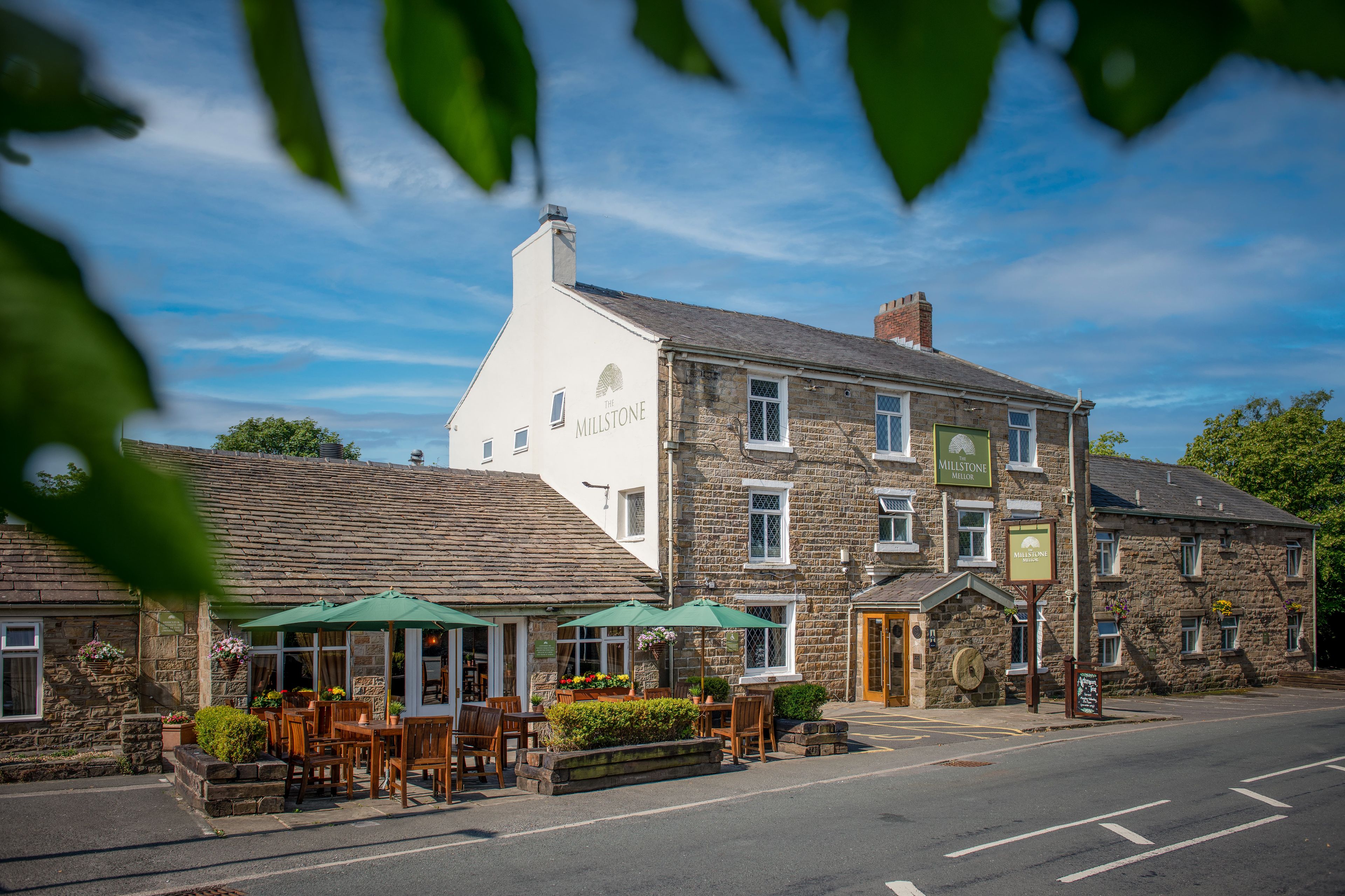 exterior of the millstone and outside seating area