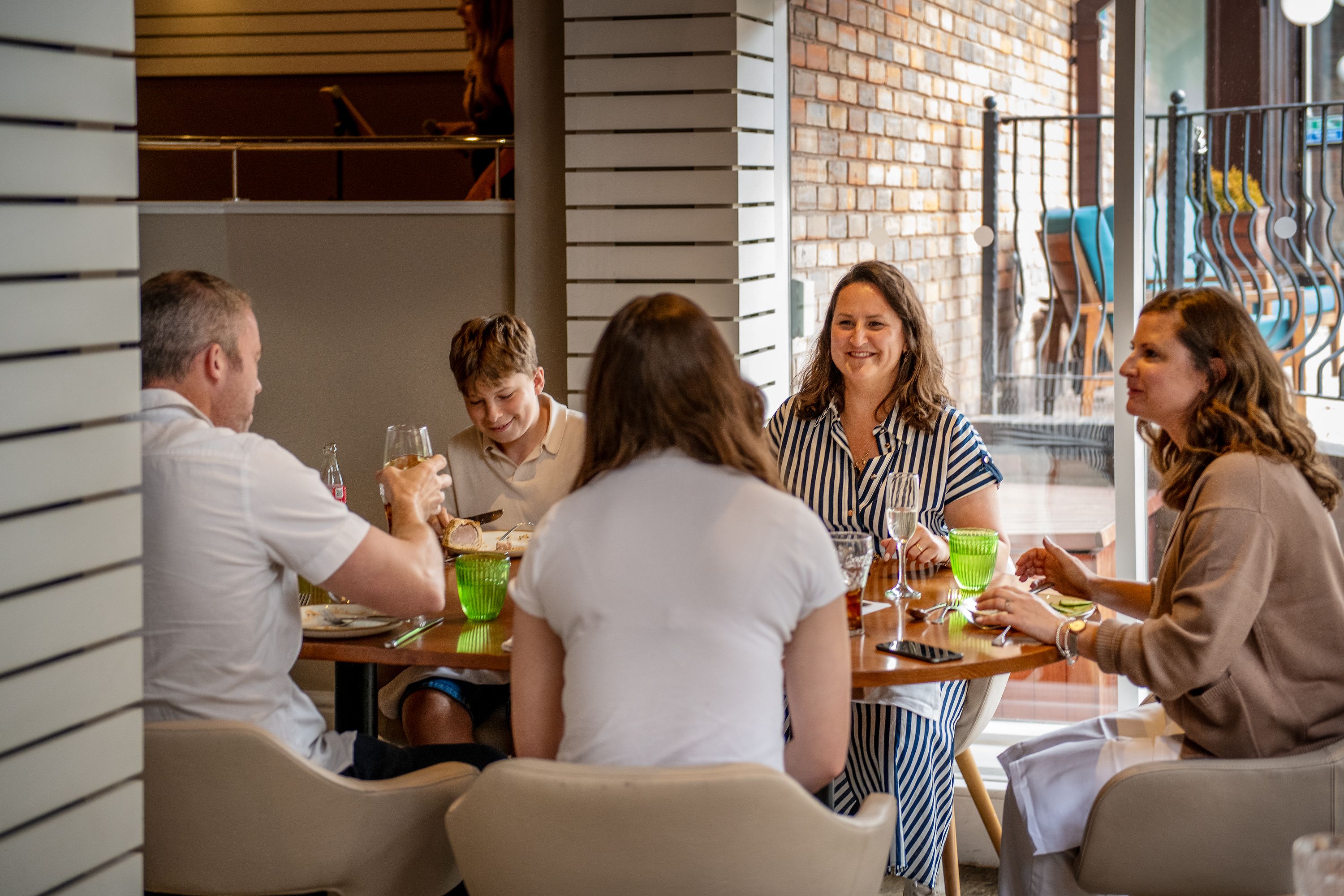 Family and friends enjoying a meal